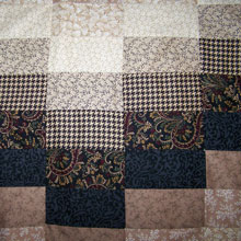 Patchwork Quilt Close Up by Holly