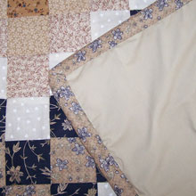 Patchwork Quilt Close Up by Holly
