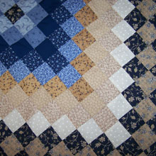 Patchwork Quilt Close Up by Holly